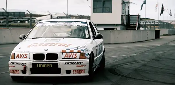 BMW race car on track during a driver coaching session